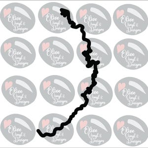 May include: A collection of gray oval stickers with a pink heart and the text "Olive Vinyl & Designs" in white script. A black, jagged line cuts through the image, obscuring some stickers.