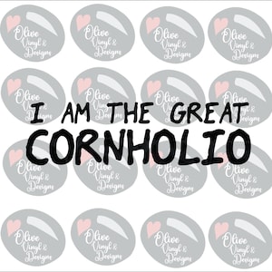 May include: White background with multiple gray oval stickers, each featuring a pink heart and the text "Olive Vinyl & Designs." The phrase "I AM THE GREAT CORNHOLIO" is written in bold black letters.