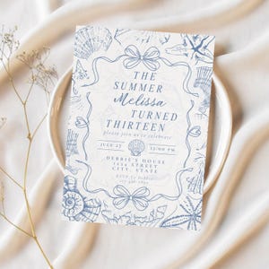 May include: A light blue invitation card with a seashell theme. The text reads "The Summer Melissa Turned Thirteen" with event details. The card is surrounded by seashell illustrations and bow accents.