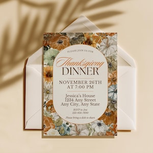 May include: A rectangular Thanksgiving dinner invitation card featuring a central oval frame with text surrounded by a floral and pumpkin border in shades of orange, green, and white. The text reads: Please join us for Thanksgiving Dinner, November 26th at 7:00 PM, Jessica's House, 1234 Any Street, Any City, Any State, RSVP to Jess 123-456-7890, Please bring a dish to share.