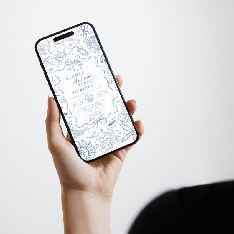 May include: A smartphone displays a blue and white invitation with seashell illustrations. The text reads "The Summer Melissa Turned Thirteen." The phone is held in a person's hand against a white background. The invitation includes event details.