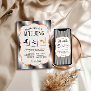 May include: A rectangular invitation card and a smartphone displaying the same design, both featuring black and white vertical stripes, an orange scalloped border, and the text Tricks, Treats & MAHJONG with illustrations of a witch hat, bats, and candy corn.