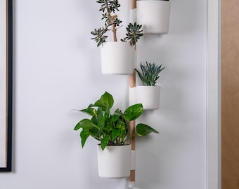 Sistema de plantas verticales para pared: moderno, flexible y bien diseñado con varilla de plástico.