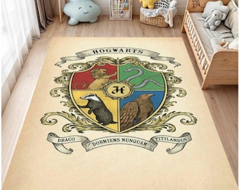 May include: A rectangular beige rug featuring the Hogwarts crest. The crest is a shield divided into four sections, each with a different animal and color. The words "HOGWARTS", "DRACO", "DORMIENS NUNQUAM", and "TITILANDUS" are also visible.