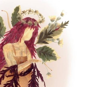 May include: A dried flower art piece depicting a woman with long red hair wearing a crown of dried flowers. The woman is wearing a dress made of dried flowers and leaves. The background is a light pink.