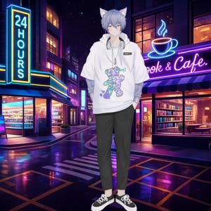 May include: A person wearing a white t-shirt with a colorful bear graphic, black pants, and black and white sneakers. The person has gray cat ears and headphones around their neck. The background features a neon sign that says "Book & Cafe."