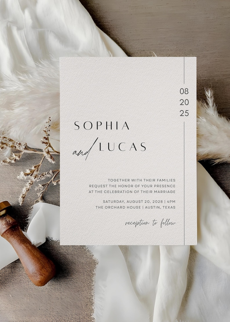 May include: A minimalist wedding invitation with the names "Sophia and Lucas" in elegant script. The invitation includes the date, time, and location of the ceremony, with a neutral color palette and a simple design. The text "reception to follow" is also included.