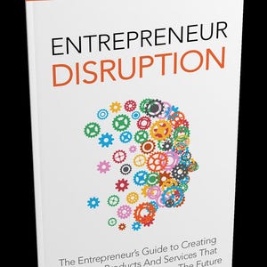 Op de afbeelding: Een boek getiteld "ENTREPRENEUR DISRUPTION" met een oranje en zwart kleurenschema. De omslag toont een kleurrijk tandwielontwerp in de vorm van een hoofd. De tekst hieronder luidt: "The Entrepreneur's Guide to Creating Innovative Products And Services That Disrupt Markets And Change The Future."
