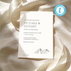 May include: A wedding invitation with the names "Victoria & Zachary" in elegant typography. The invitation includes event details, a mountain illustration, and the text "black tie attire". The design is set against a cream-colored background.