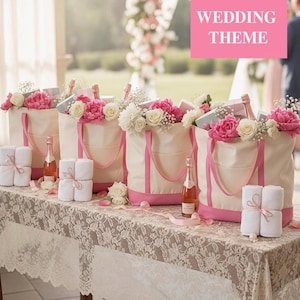 May include: Four cream-colored canvas tote bags with pink trim, each filled with white and pink flowers, small gift boxes, and a bottle of rose wine. Each bag is accompanied by a stack of two white folded towels tied with a pink ribbon.