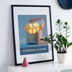 May include: Framed art print featuring a box of glowing yellow rods labeled "FISSION CHIPS." The print has a blue background and a radiation symbol on the box. A pink vase and a potted plant are on a white shelf.