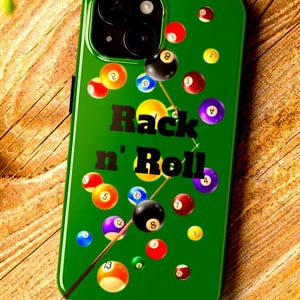 May include: Green phone case featuring a billiards theme. The case has a glossy finish and displays various billiard balls and the text "Rack n' Roll". The design includes a cue stick and a yellow cue ball.