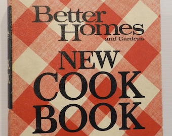 May include: A hardcover cookbook titled Better Homes and Gardens New Cook Book with a red and white checkered pattern on the cover. The text is printed in bold black lettering across the front, featuring the title and brand name clearly.