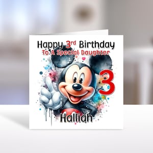 May include: A birthday card featuring Mickey Mouse with the text "Happy 3rd Birthday To A Special Daughter". The number "3" is in red, and the name "Halliah" is below Mickey Mouse.