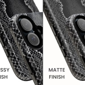 May include: Close-up of two phone cases with a snake skin pattern. One case has a glossy finish, and the other has a matte finish. The cases are black, white, and gray. The text "GLOSSY FINISH" and "MATTE FINISH" are visible.