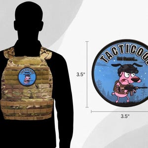 May include: A camouflage tactical vest with a round patch, 8.9 cm in diameter. The patch features a cartoon dog holding a rifle, with the text "TACTICOOL... But Scared" in a circular design. The vest is worn by a person.