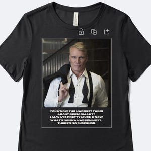 May include: Black t-shirt featuring a framed image of a man in a white shirt, black bow tie, and a black jacket draped over his shoulder. The image includes text: "YOU KNOW THE HARDEST THING ABOUT BEING SMART? I ALWAYS PRETTY MUCH KNOW WHAT'S GONNA HAPPEN NEXT. THERE'S NO SUSPENSE."