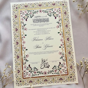 May include: Ivory wedding invitation with gold and floral border. The invitation includes text in English and Arabic, with the names 'Ichman Khan' and 'Sara Ghairi'. The date is April 12th, 2025.