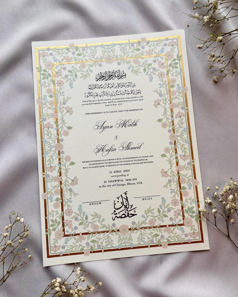 May include: A wedding certificate with floral border in soft pink, blue, and green. The document features gold accents and elegant calligraphy with the names Ayan Malik and Hafsa Ahmed, along with the date April 15, 2025, and location.