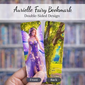 May include: Double-sided bookmark featuring a fairy in a purple dress with wings, and the text "Aurielle Fairy Bookmark." The back of the bookmark shows a scenic view of a tree and a path. The bookmark is held in a hand.