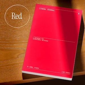 May include: A bright red notebook with the text "CINEMA JOURNAL" and "A NOTEBOOK FOR INTENTIONAL WATCHING." The notebook has 120 pages and is by K&uuml;nel Studio. The word "Red" is in a white circle in the upper left corner.