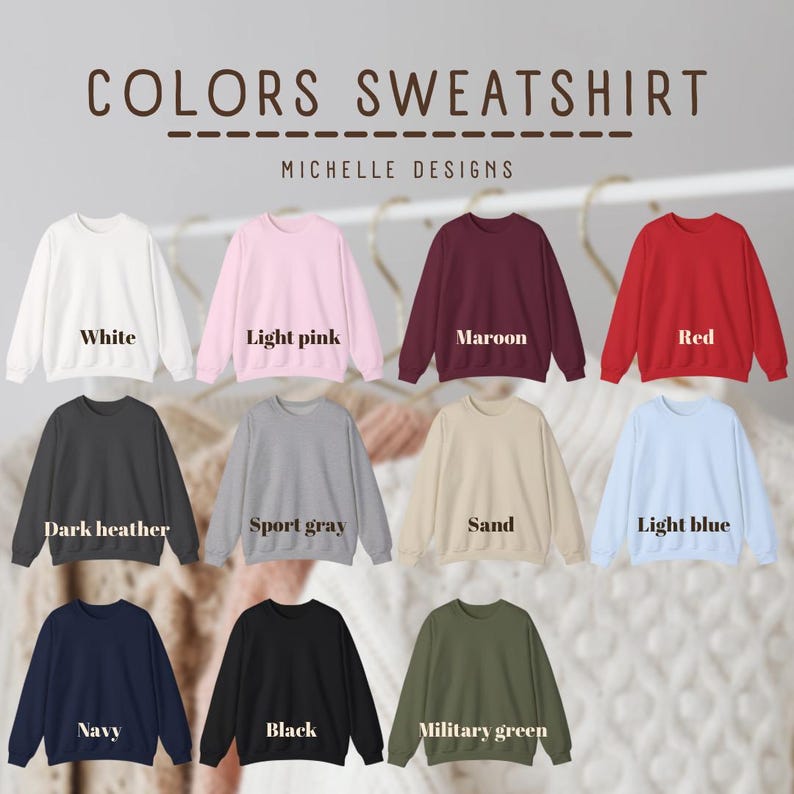 May include: A color chart for sweatshirts featuring eleven long-sleeve crewneck pullovers in white, light pink, maroon, red, dark heather, sport gray, sand, light blue, navy, black, and military green, with the text COLORS SWEATSHIRT MICHELLE DESIGNS.