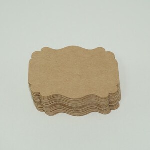 May include: A stack of brown, scalloped paper gift tags.