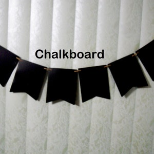 May include: A black chalkboard banner with the word "Chalkboard" printed on it. The banner is strung with twine and has seven triangular flags.