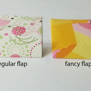 May include: Two envelopes with different flap styles. The envelope on the left has a regular flap and a white background with pink, green, and brown polka dots. The envelope on the right has a fancy flap and a yellow background with pink, orange, and yellow swirls.