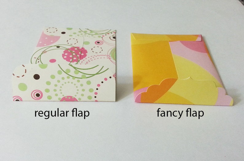 May include: Two envelopes with different flap styles. The envelope on the left has a regular flap and a white background with pink, green, and brown polka dots. The envelope on the right has a fancy flap and a yellow background with pink, orange, and yellow swirls.