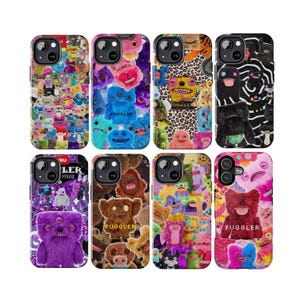 May include: Eight phone cases with colorful monster designs. Each case features a different pattern of quirky, plush-like creatures in various colors, including blue, pink, and brown. Some cases have the word "FUGGLER" printed on them.