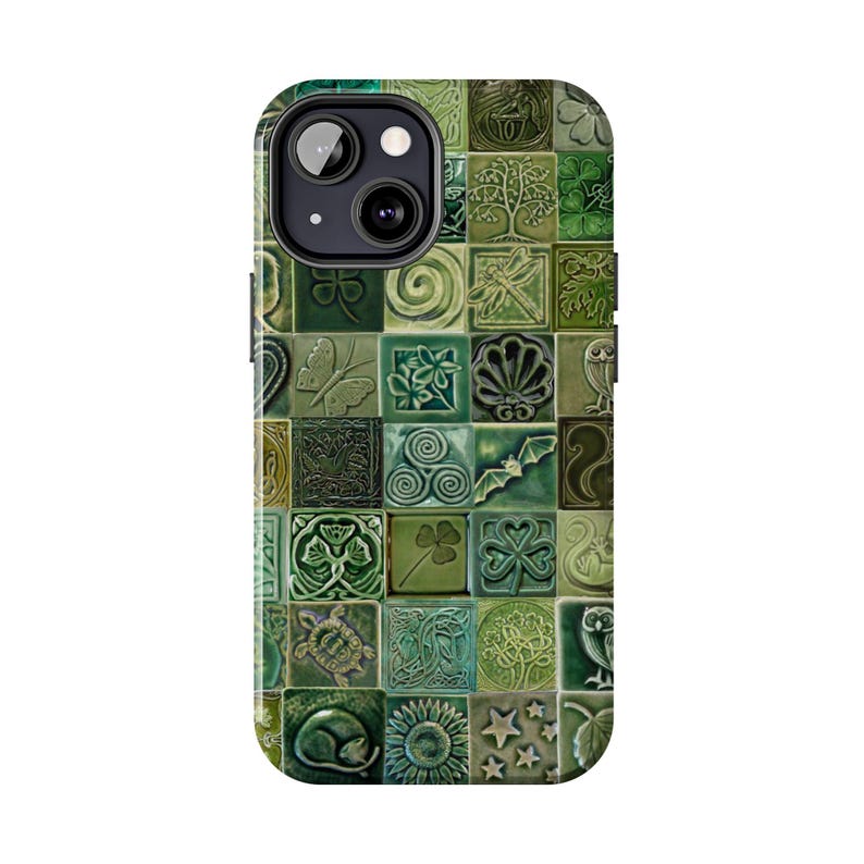 May include: Green phone case with a mosaic tile design. The case features various embossed images, including a butterfly, owl, shamrock, and turtle. The tiles are in shades of green, creating a textured appearance.