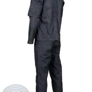 May include: A white ceramic mug with a black handle and the text "But First, Coffee" in a black, handwritten-style font. The mug is on a white surface.