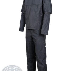 May include: A set of three ceramic mugs with a speckled, matte finish. The mugs are in shades of cream, light gray, and dark gray. Each mug has a simple, minimalist design, perfect for coffee or tea.