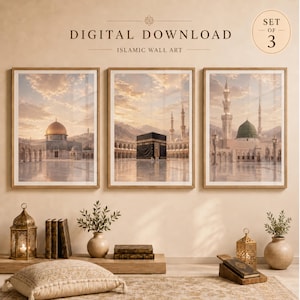 May include: A set of three digital download Islamic wall art prints featuring the Dome of the Rock, the Kaaba, and the Prophet's Mosque. Each framed print displays architectural landmarks under a soft, golden sunset sky with clouds.