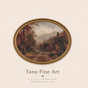 May include: An oval-shaped gold frame containing a landscape painting of a forest with autumn-colored trees and a winding path. Below the frame, the text reads: Tana Fine Art, DIGITAL DOWNLOAD, PRINTABLE WALL ART, in a dark brown serif font.
