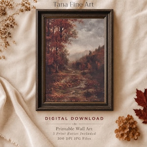May include: A framed landscape painting featuring a path winding through a forest with autumn foliage in shades of red, orange, and brown under a cloudy sky. The text Tana Fine Art, DIGITAL DOWNLOAD, and Printable Wall Art are visible.