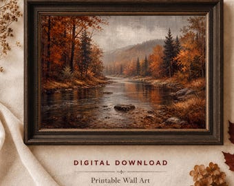 May include: A framed landscape print titled Tana Fine Art featuring a river flowing through an autumn forest with orange and brown foliage, dark evergreen trees, and rocky banks. The text below reads DIGITAL DOWNLOAD, Printable Wall Art.