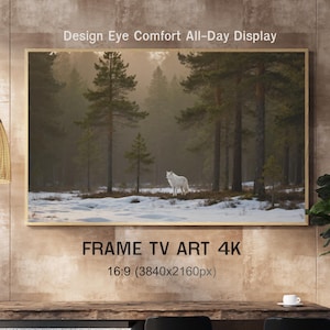 May include: A framed art print depicting a white wolf in a snowy forest scene. The artwork is displayed on a wooden table. The text "Design Eye Comfort All-Day Display" and "FRAME TV ART 4K" are visible.