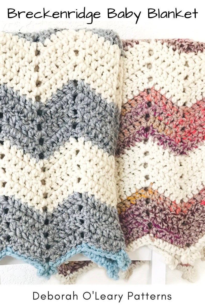 May include: Two crocheted baby blankets, one in white, gray, and blue, and the other in white, pink, and purple. The blankets are folded and placed on a white surface. The text "Breckenridge Baby Blanket" is at the top of the image. The text "Deborah O'Leary Patterns" is at the bottom of the image.