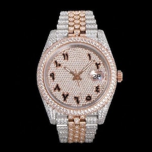 May include: A luxury wristwatch with a diamond-encrusted face and band. The watch features Arabic numerals and a date display. The band is a combination of silver and rose gold. The watch is set against a black background.