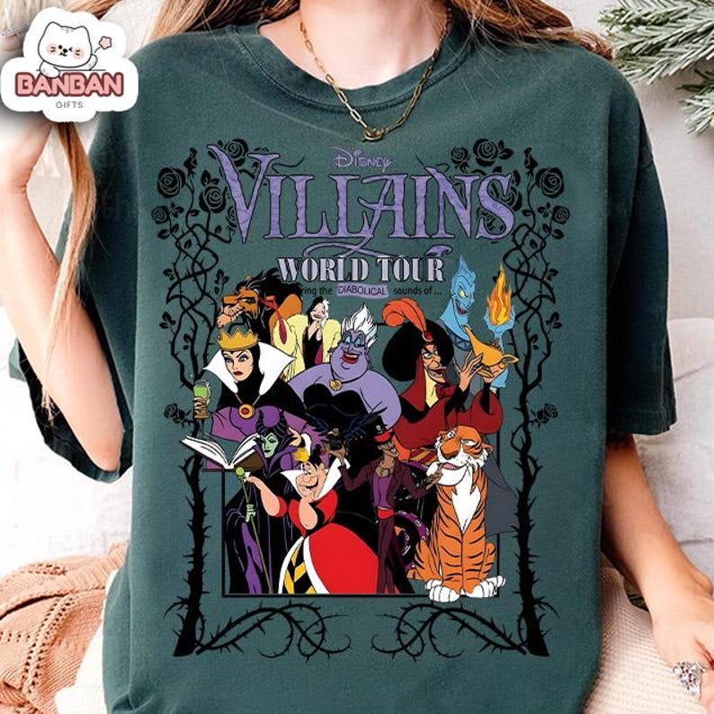 A green t-shirt with a graphic design featuring characters from the Disney film " Villains World Tour".