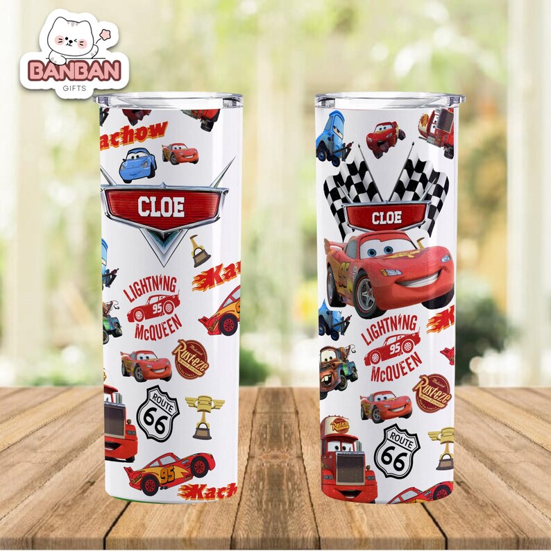 two white tumblers with a design of various cars and racing-related elements, including a character named Cloe.