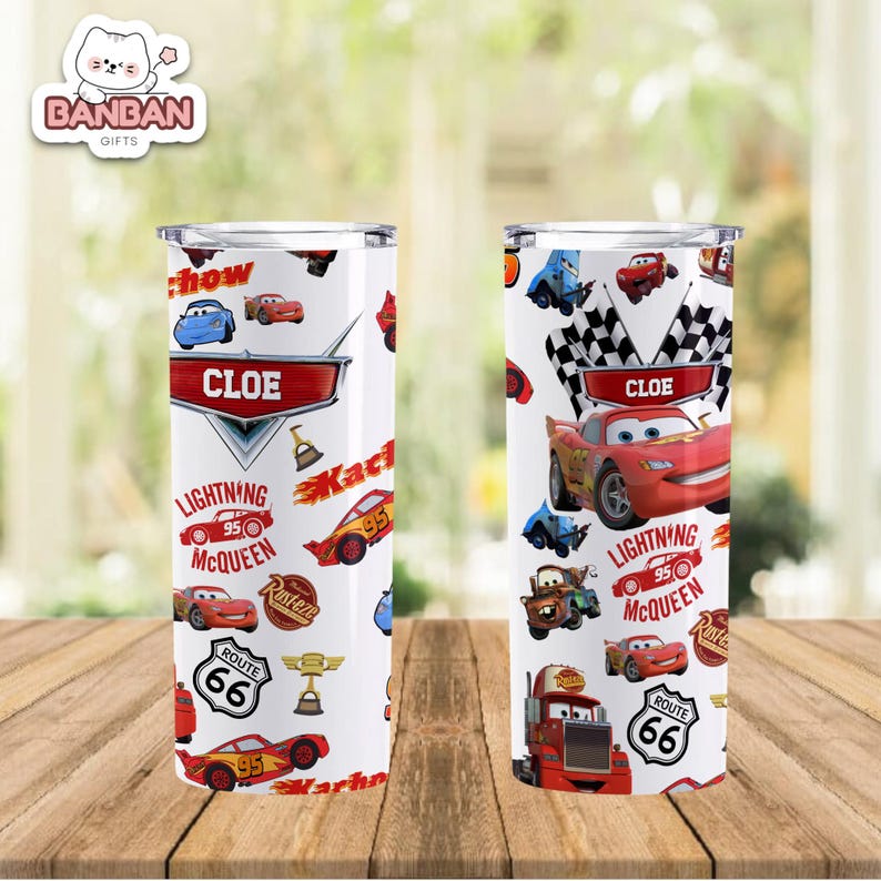 two cylindrical containers with a design inspired by the Cars movie franchise. The design includes various cars, trucks, and other elements commonly associated with the movie, such as lightning bolts and checkered flags. The containers are placed on a wooden surface, and the background is blurred, drawing attention to the design on the containers.