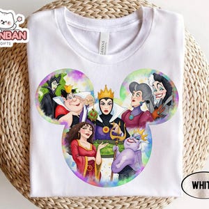 A white t-shirt with a colorful illustration of Disney characters from the Disney film "The Dark Knight" displayed on it.