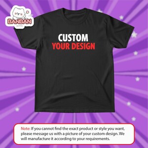 The image is a black t-shirt with the text "CUSTOM YOUR DESIGN" printed on it.