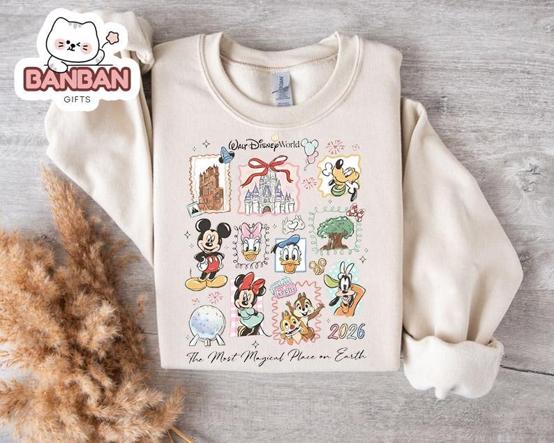 A white sweatshirt with a Disney World-themed graphic design, featuring various Disney characters and landmarks.