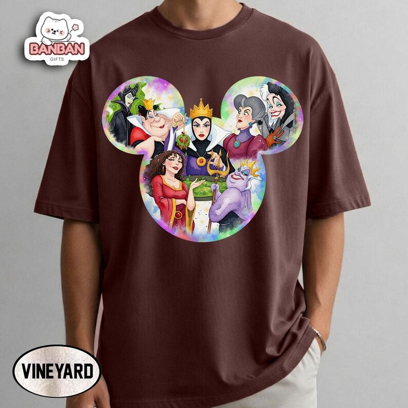 A t-shirt with a design featuring various Disney princess characters, including Belle, Cinderella, Snow White, and others, arranged in a stylized manner.