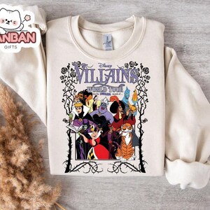 A white t-shirt with a graphic design featuring characters from the Disney animated film " Villains World Tour".