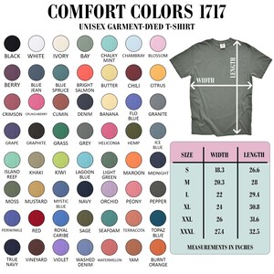 The image is a color swatch for a unisex garment-dye t-shirt, featuring a variety of different colored t-shirts alongside their corresponding measurements.